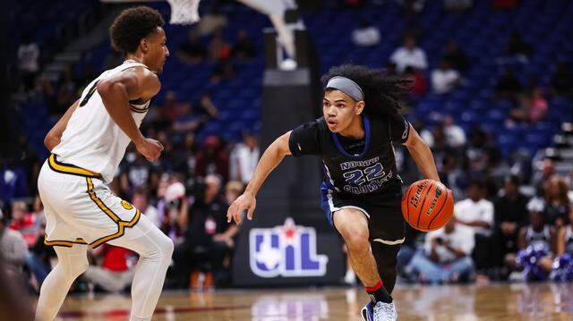 North Crowley guard Isaak Hayes (22) drives with the basketball against a San Antonio Brennan defender in the Class 6A Division I state championship at The Alamodome in San Antonio, Texas, March 14, 2026. North Crowley guard Isaak Hayes (22) drives with the basketball against a San Antonio Brennan defender in the Class 6A Division I state championship at The Alamodome in San Antonio, Texas, March 14, 2026.