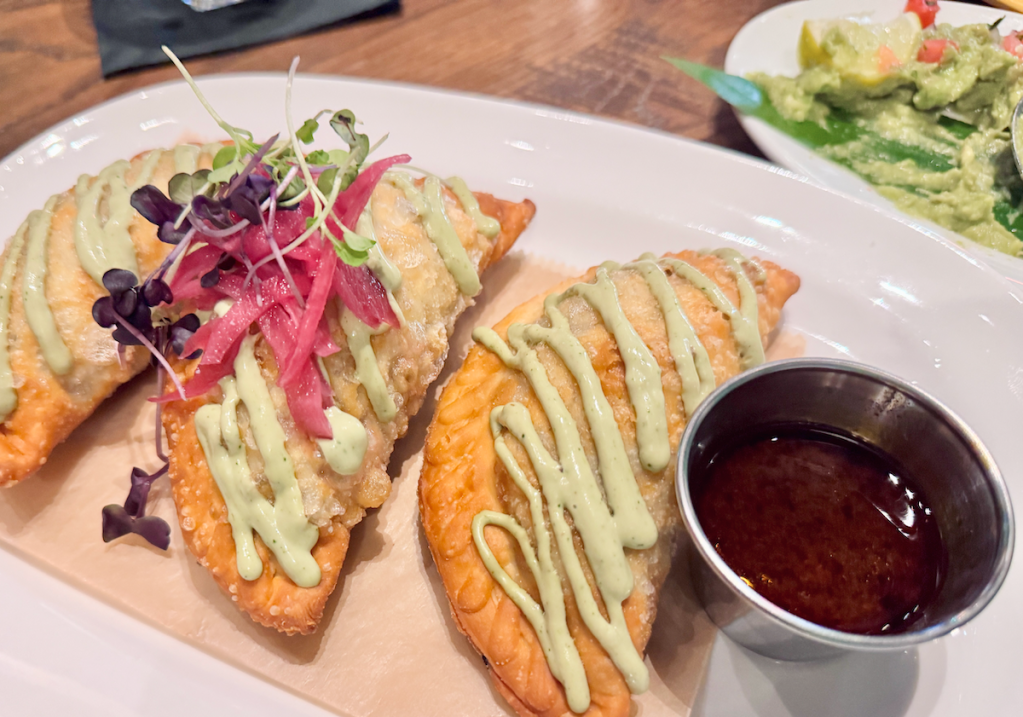 Close up of three brisket birria empenadas with empenadas, some of the new items on the menu at Milagro Tacos Cantina