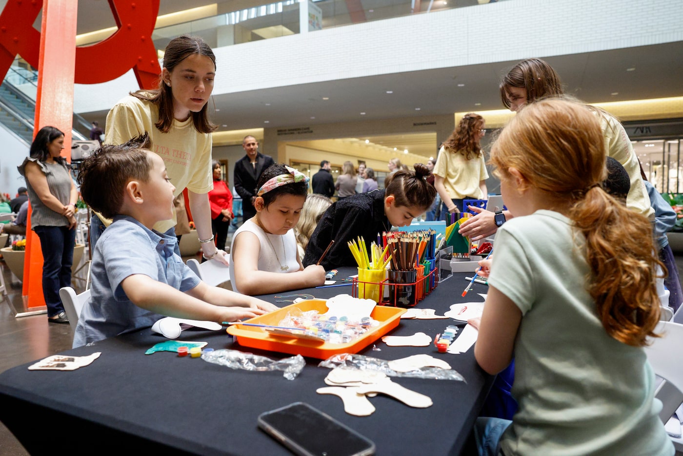 Emmie Rush, Dallas Baptist University Delta Theta sorority member helps pediatric patient...