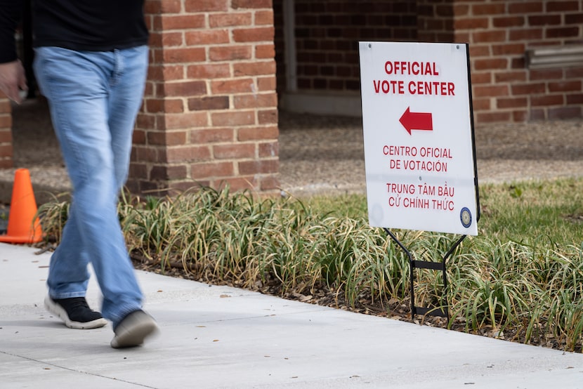 A voter exits a primary polling center at University Park United Methodist Church on...