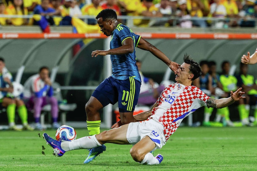 Croatia forward Petar Musa (26) makes a sliding block against Colombia midfielder Jhon Arias...