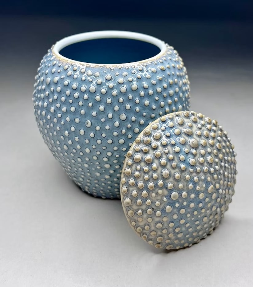 Raised, bead-like detailing gives this jar by Mary German a sculptural, touchable appeal.
