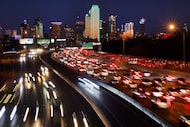 Traffic is backed up on eastbound Interstate 30 (right) as it approaches downtown Dallas,...