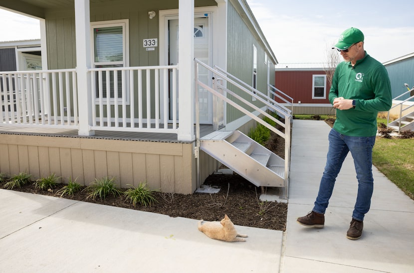 OurCalling CEO and Pastor Wayne Walker looks at OurCat, also known as OC, during a tour of...