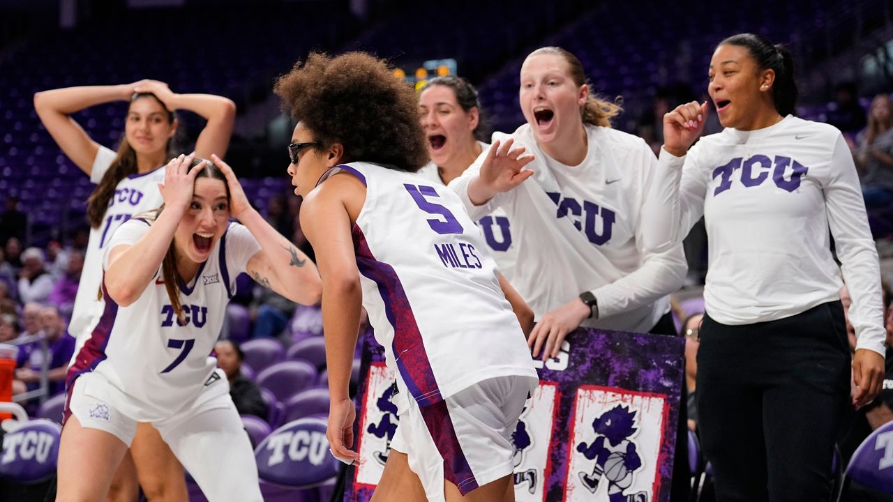 TCU's Marta Suarez (7) and the rest of the bench react after guard Olivia Miles (5) sunk a three-pointer in the second half of an NCAA women's basketball game against Arkansas Pine Bluff in Fort Worth, Texas, Tuesday, Dec. 16, 2025. (AP Photo/Tony Gutierrez)