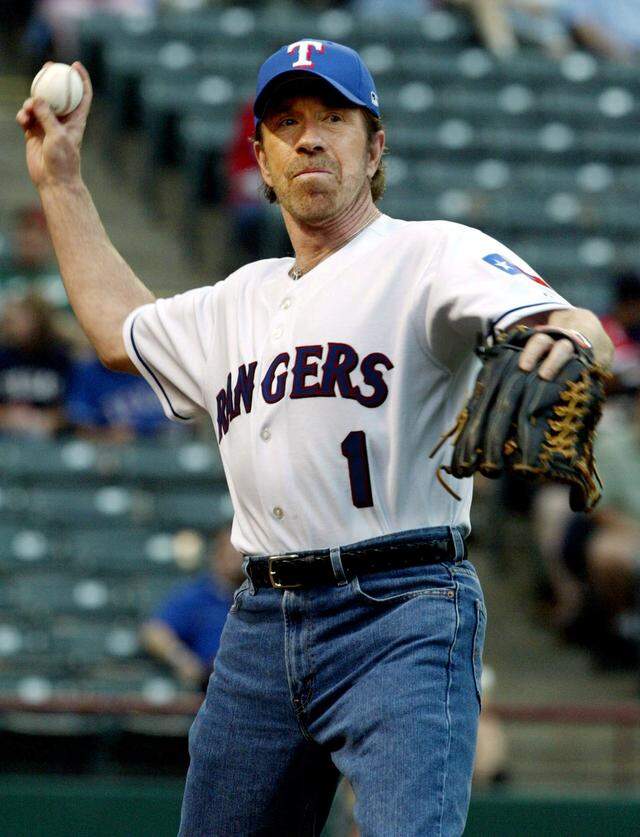 May 7, 2005: Actor Chuck Norris plays catch with Texas Rangers' John Wettland before throwing out the first pitch for the Rangers-Cleveland Indians game at Ameriquest Field in Arlington. The Rangers won, 6-1.