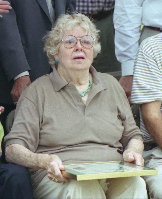 Doris Edwards of Argyle watches as a marker is dedicated to the memory of her husband, Texas Department of Public Safety patrolman Edward Bryan Wheeler, and patrol partner H.D. Murphy.