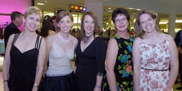 April 22, 2006: At the Ridgmar Mall’s Neiman Marcus, supporters of a therapy group attend a benefit fashion show. From left, Erin Harvey, Jenny Mize, Amy Whitehead, Suzie Rosenberger and Melissa Roy.