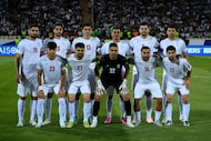 FILE - Iran's players pose for a team photo before an Asian group A qualifying soccer match...