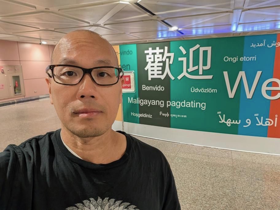 Petey Feng standing in the airport in Taipei
