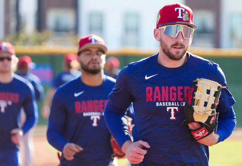 Texas Rangers minor league outfielder Paxton Kling runs between drills during a spring...