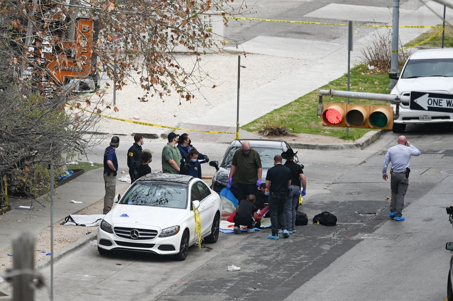 The Austin Police Department and the FBI investigate a shooting at Buford's on 6th Street on Sunday, March 1, 2026, in Austin, Texas. (AP Photo/Jack Myer)