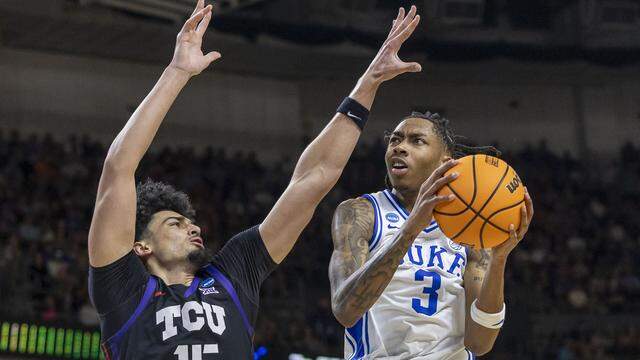 Duke forward Isaiah Evans (3) drives to the basket against TCU forward David Punch in the first half Saturday during the second round of the NCAA Tournament at Bon Secours Arena in Greenville, S.C.