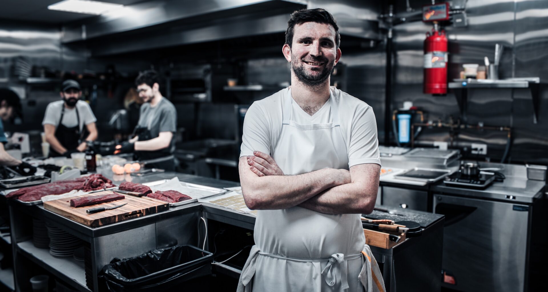 RJ Yoakum standing in the kitchen at Sushi Kozy.
