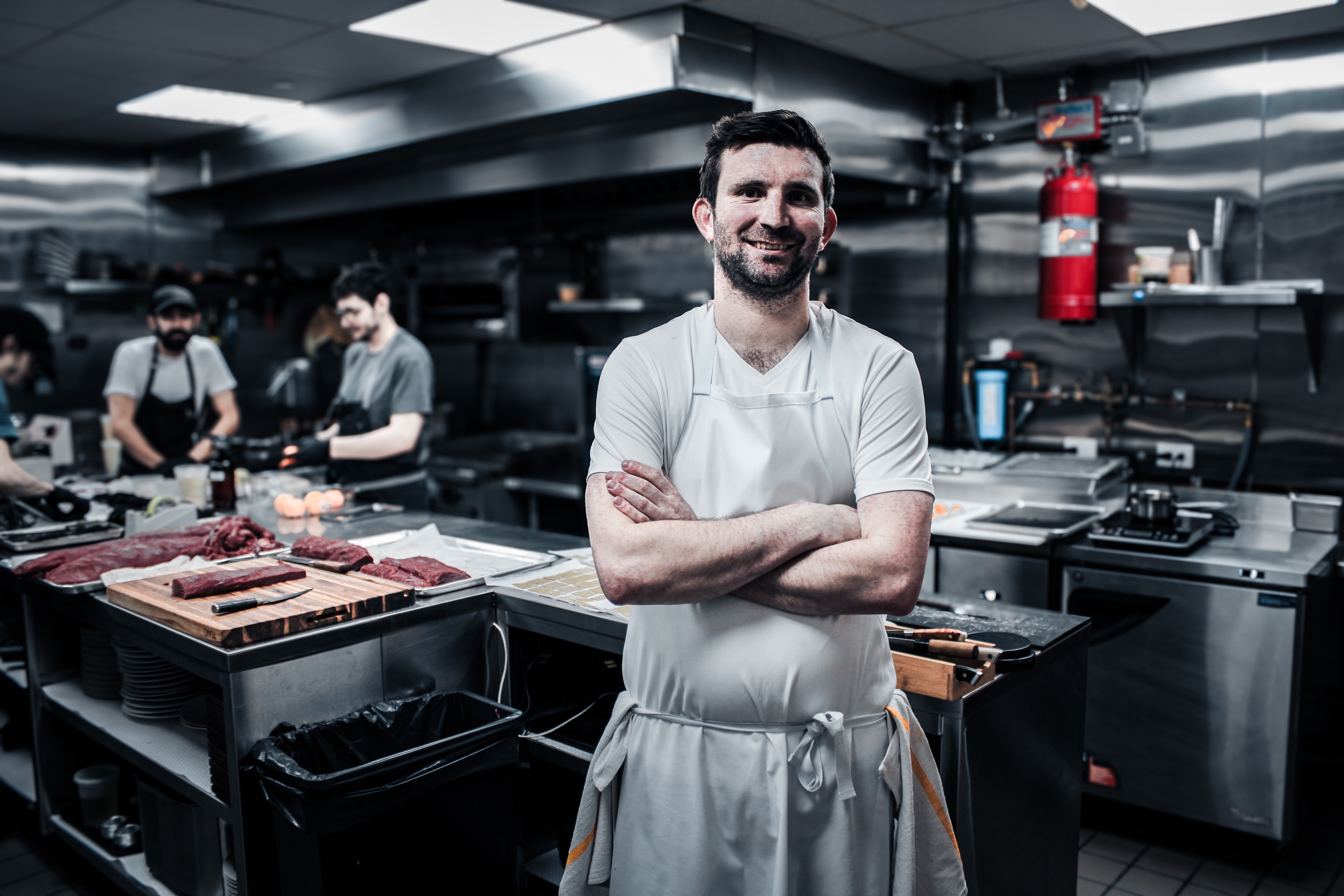 RJ Yoakum standing in the kitchen at Sushi Kozy.