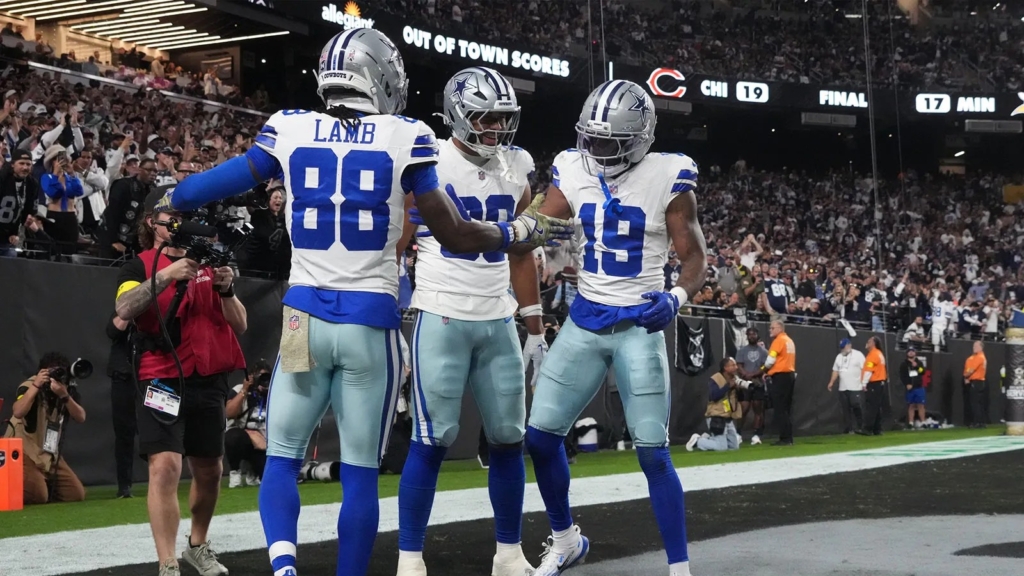 Ryan Flournoy celebrating with Dallas Cowboys teammates after scoring a touchdown at AT&T Stadium