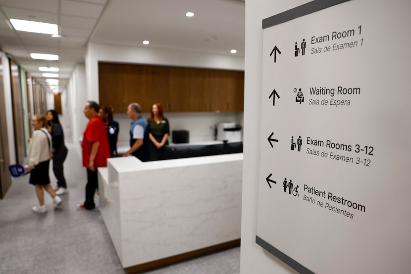 Guests tour the Parkland Health Center inside the Jewish Family Service of Dallas facility,...