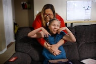 After moving her from the wheelchair to the couch, Liz Piñón adjusts her daughter Felicita...