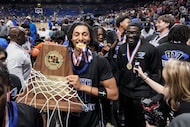 North Crowley wing Jonathan Fox celebrates with the championship trophy after a victory over...