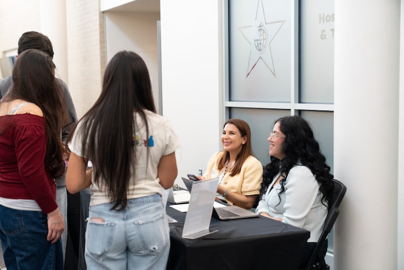Garland ISD students speak with employers at the school district's Gilbreath-Reed Career and...