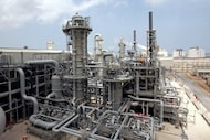 FILE - This April 4, 2009, file photo, shows a gas production facility at Ras Laffan, Qatar....