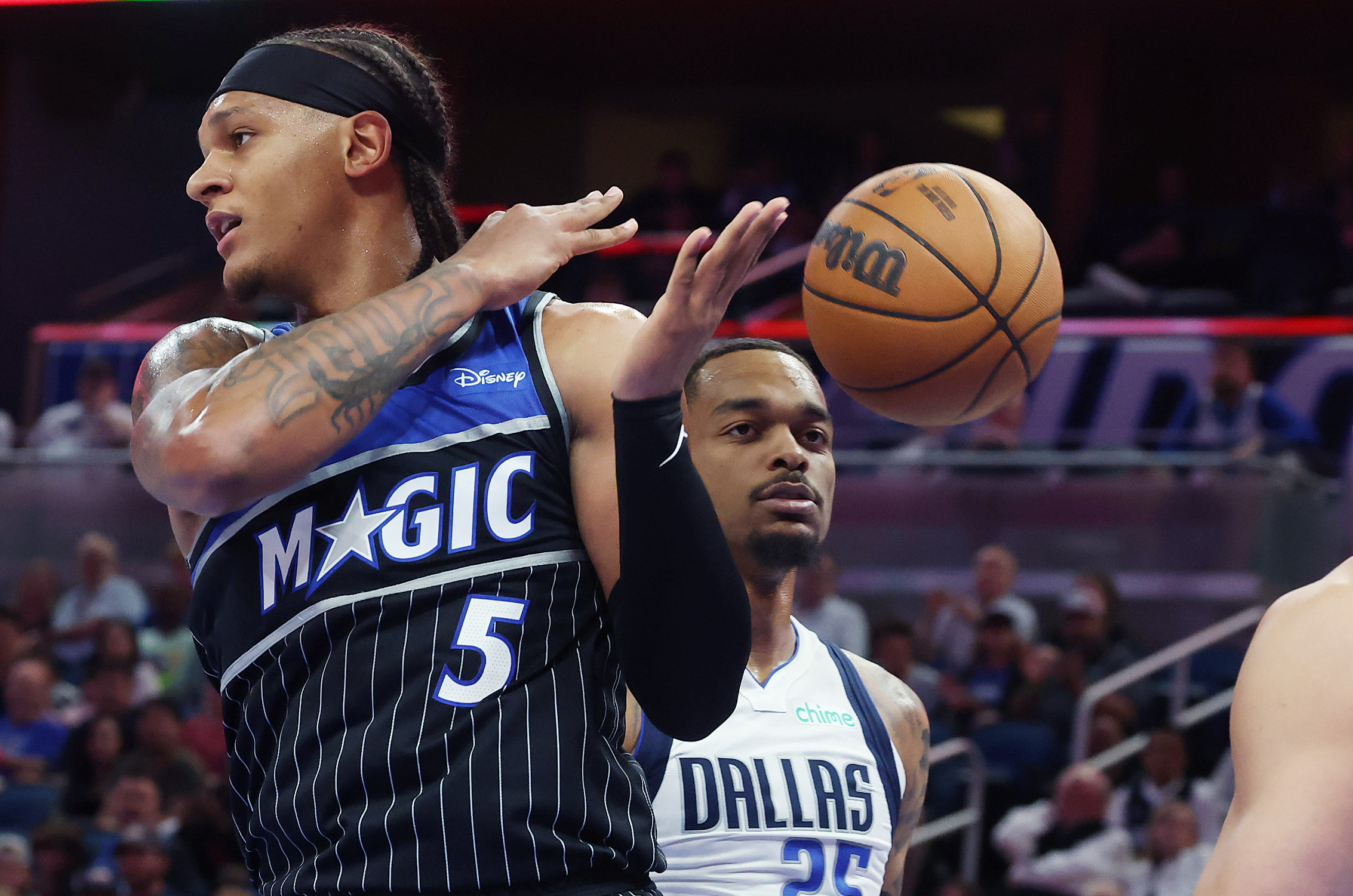 Orlando forward Paolo Banchero (5) loses the ball in front...