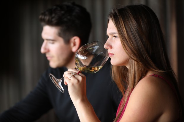 A young couple visiting from Austin, Texas, tastes wine at Hanzell Vineyards in Sonoma on Friday, Nov. 7, 2025. (Christopher Chung/The Press Democrat)
