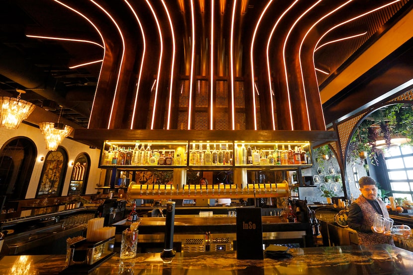 Bartender Marco Vazquez (far right) works at the bar area at InSo on March 18, 2026, in...