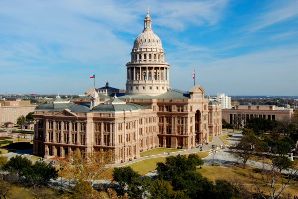 The Texas State Capitol Building in Austin, with giant dome atop a grand, four-story stone structure.
