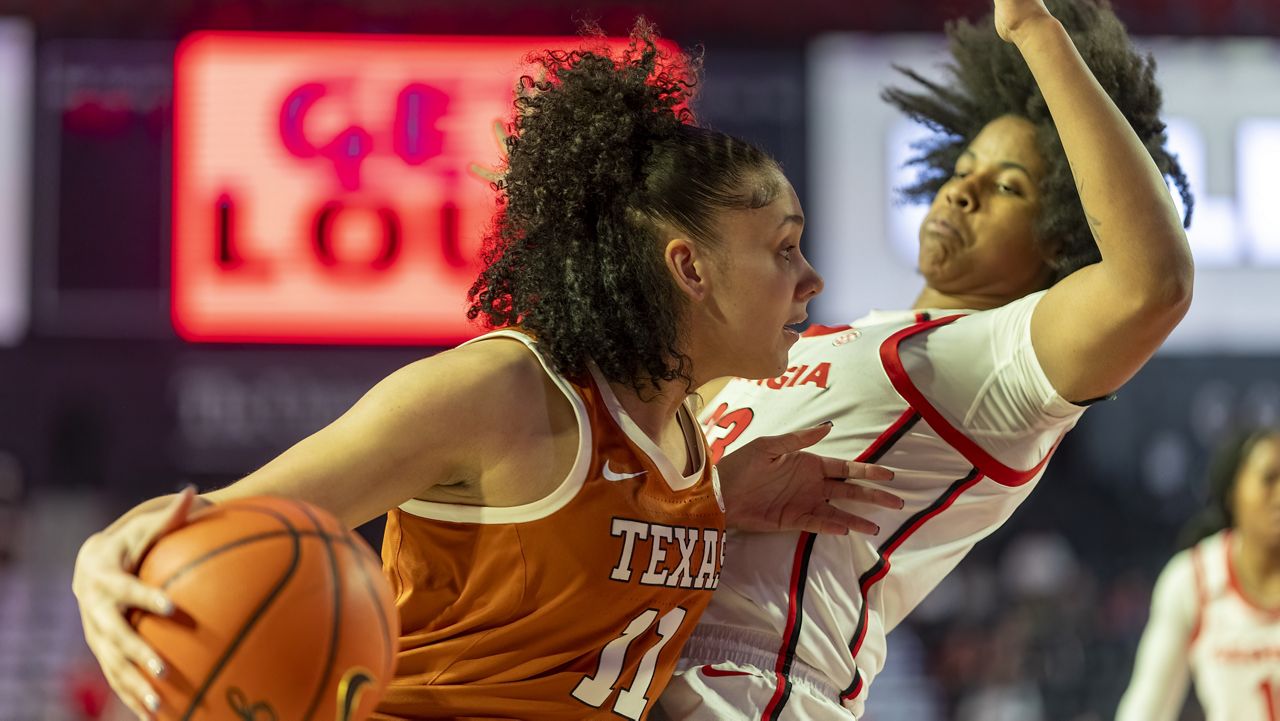 Texas forward Justice Carlton (11) fights for position during the first half of an NCAA college basketball game against Georgia, Monday, Feb. 24, 2025, in Athens, Ga. (AP Photo/Erik Rank)