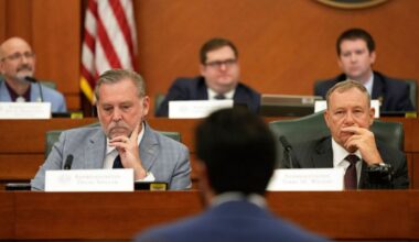 Texas state Reps. David Spiller, left, and Terry M. Wilson, right, listen to U.S. Rep. Greg Casar, center, as he gives testimony during a hearing on redistricting at the Texas Capitol, Thursday, July 24, 2025, in Austin, Texas. (AP Photo/Eric Gay)