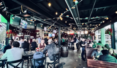 The Crafty Irishman's upstairs open-air bar full of people on a busy night.