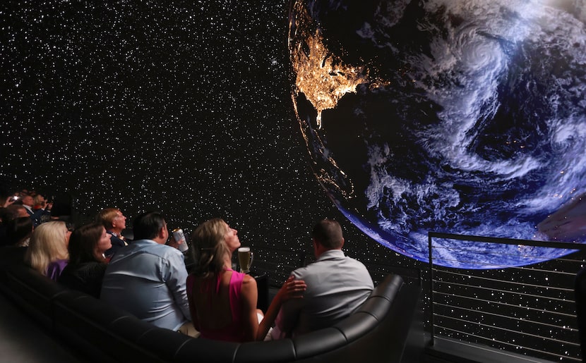 Robyn Holtz (second from right) touches her husband Brent's shoulder as the couple and other...