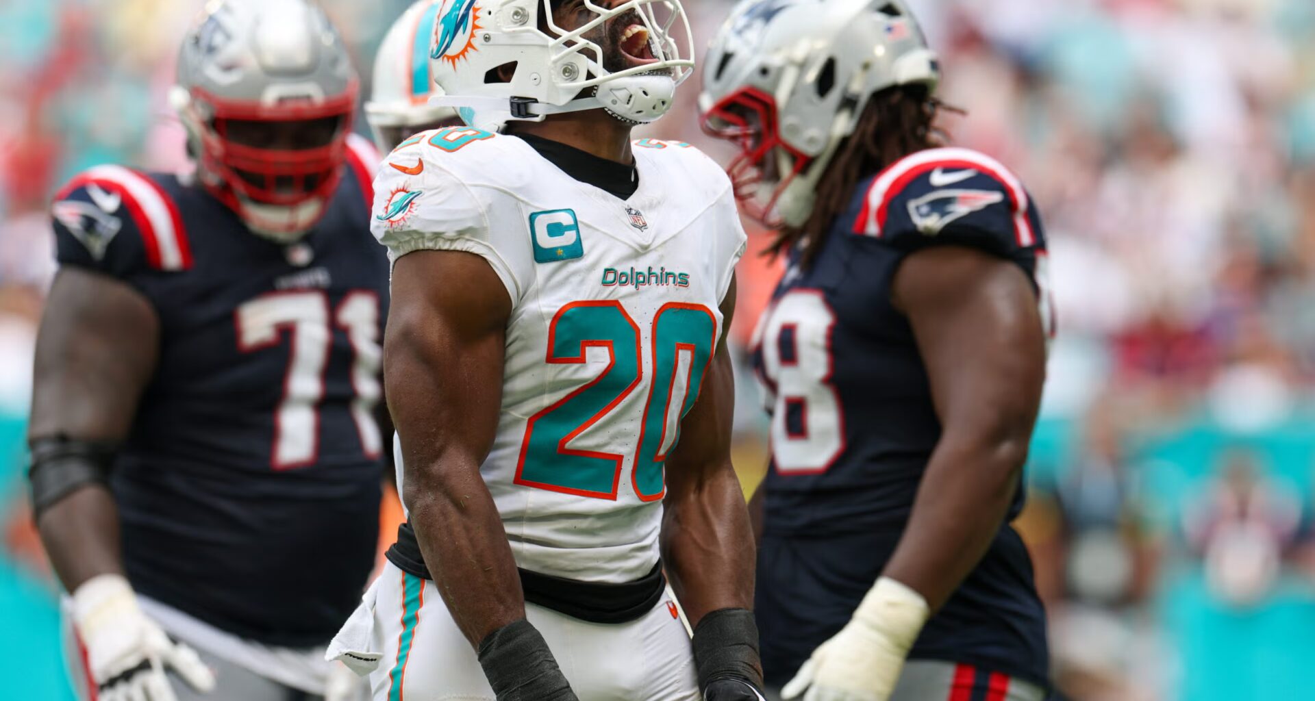 Sep 14, 2025; Miami Gardens, Florida, USA; Miami Dolphins linebacker Jordyn Brooks (20) reacts after play against the New England Patriots in the fourth quarter at Hard Rock Stadium.