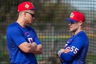 Texas Rangers shortstop Corey Seager talks with manager Skip Schumaker (55) during a spring...
