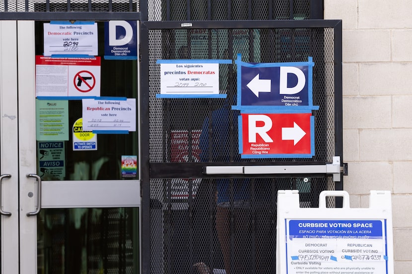 Signs tell voters which precincts are assigned to Oak Lawn Branch Library in the Democrat...