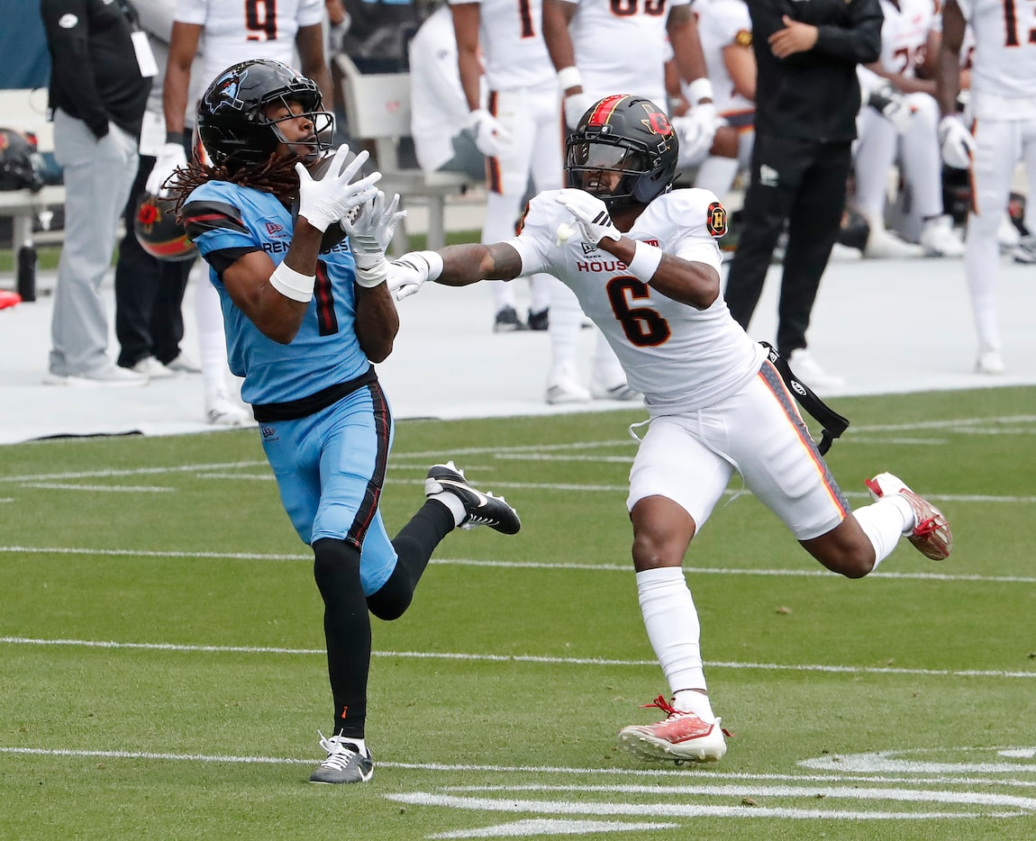 Dallas Renegades wide receiver Tyler Vaughns (1) catches a deep pass while Houston Gamblers...