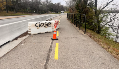 A traffic barrier partially blocking the trail Monday morning.