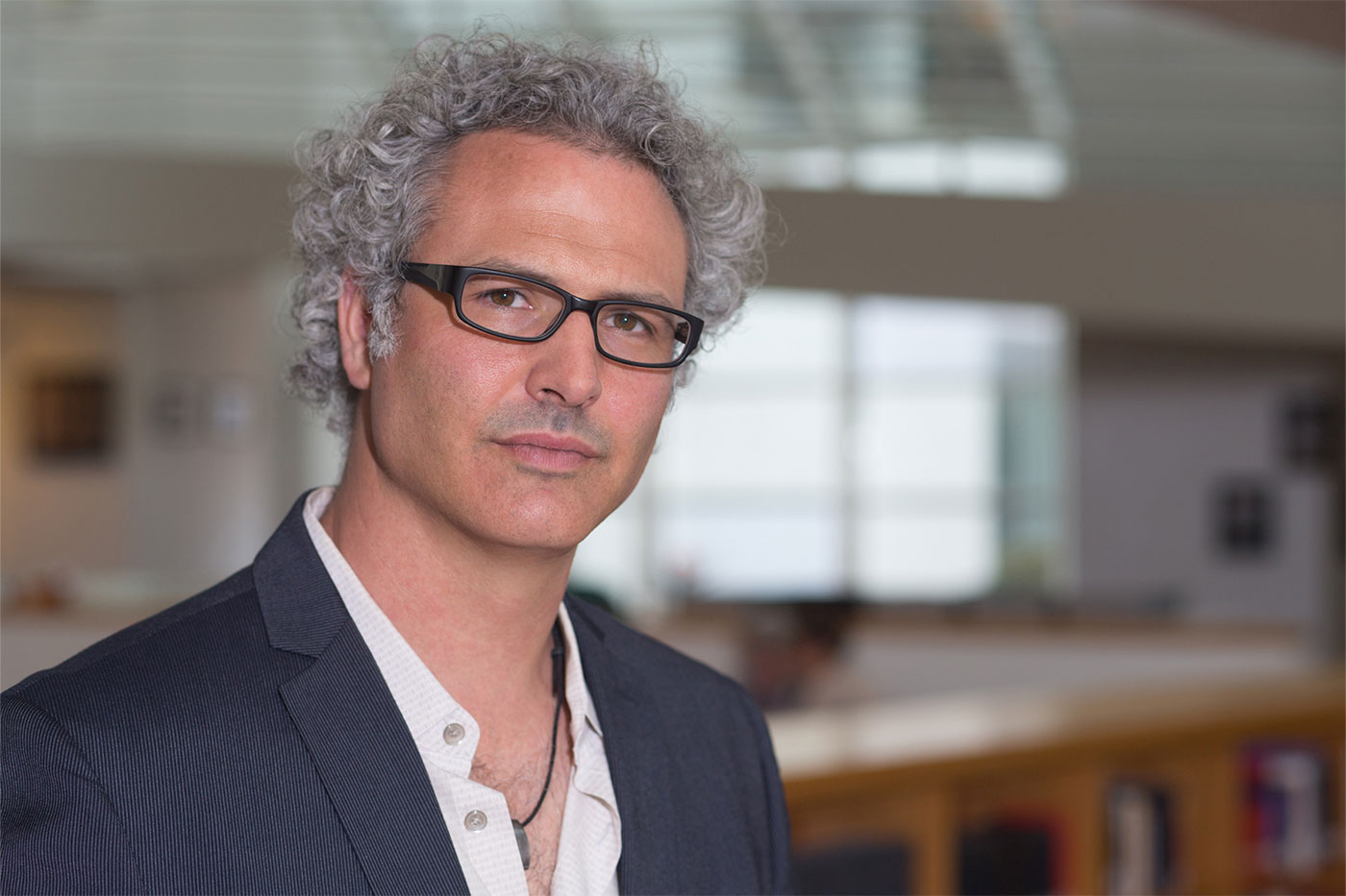 Christopher Witmore standing in a classroom 
