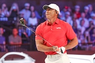 Tiger Woods of the Jupiter Links Golf Club plays his shot from the first tee during final...