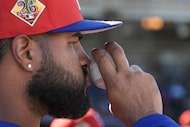 Texas Rangers pitcher Jose Corniell watches from the bench during the fourth inning of a...