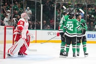 Dallas Stars center Wyatt Johnston, right, celebrates his first period goal with center...
