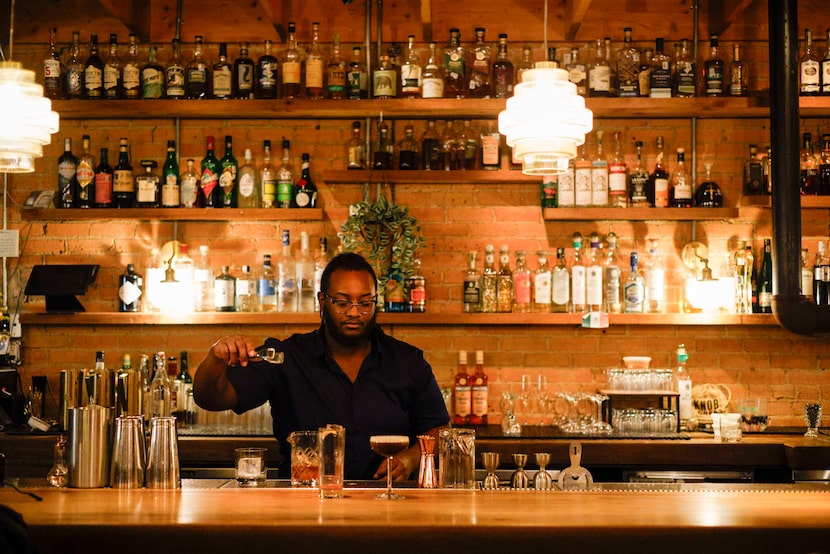 Corey Rivers, bartender, makes drinks at Rye in Lower Greenville in Dallas, on Wednesday,...