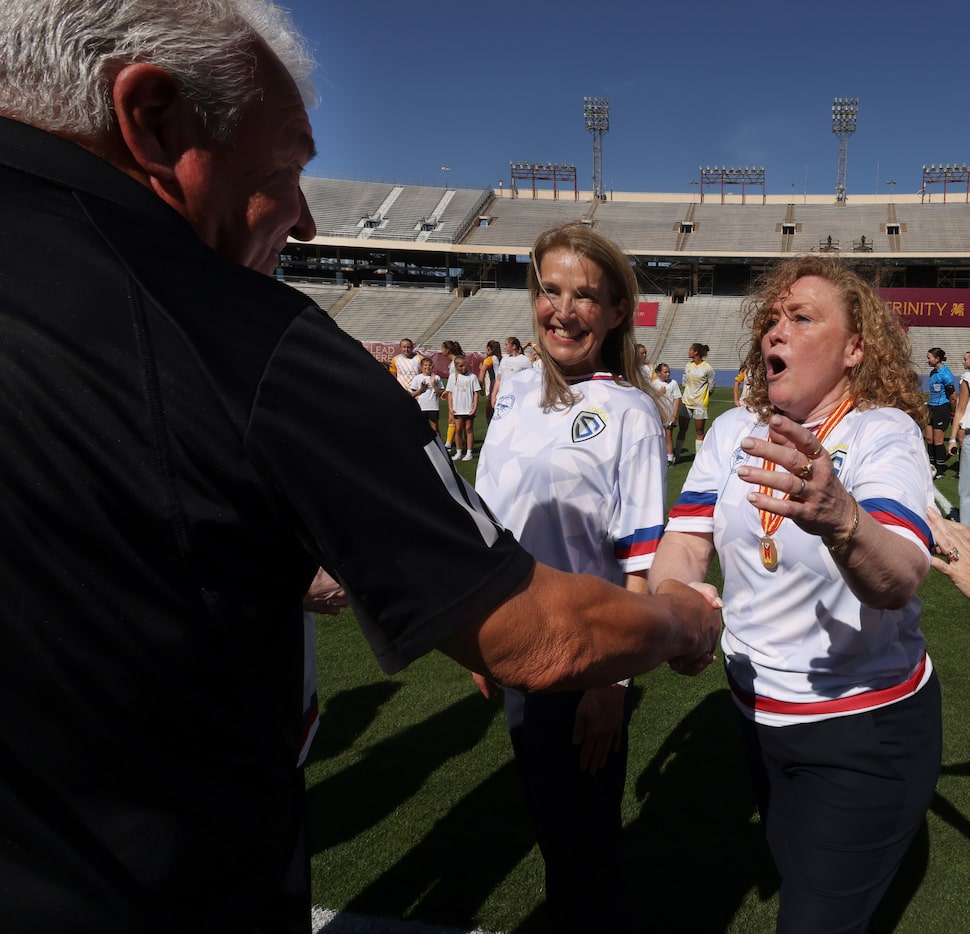 Alicia Tannery Donelan, right, reacts in shock as Sporting Jax head coach Liam Fox, left,...