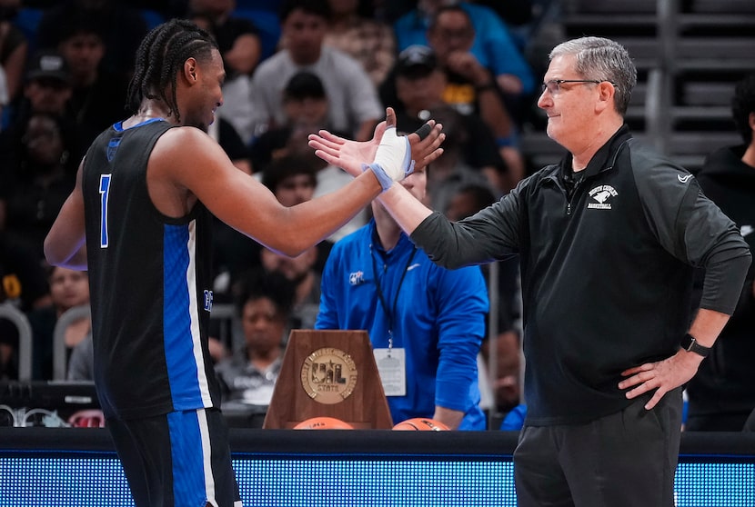 North Crowley North Crowley forward Alex Barther II celebrates with North Crowley head coach...