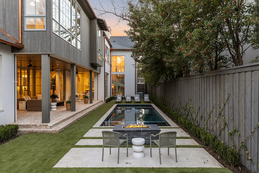 The Stratford Avenue home's backyard includes a pool, fire pit and a turfed lawn.