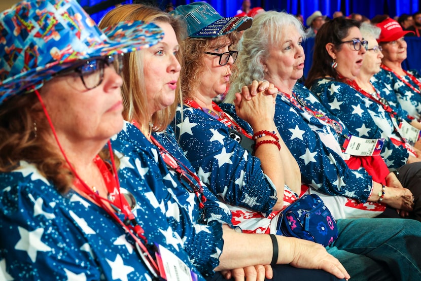 A group of attendees watch as Senator Ted Cruz, R-Texas, speaks during the final day of the...