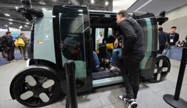 People view a Zoox self-driving vehicle at the Zoox booth during the CES tech show Tuesday, Jan. 7, 2025, in Las Vegas. (AP Photo/John Locher)
