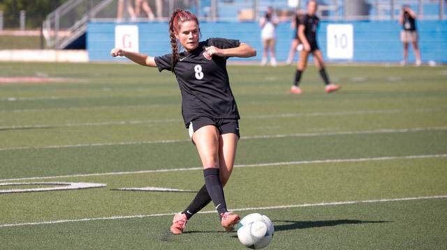 Colleyville Heritage sophomore midfielder Addison Bizjack goes for the ball in the girls’ Class 5A Division 1 UIL high school soccer state championship vs. College Station A&M Consolidated at Birkelbach Field in Georgeown on Friday, April 11, 2025.