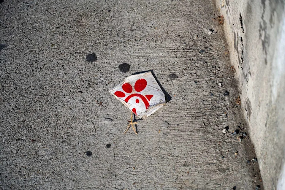 Paper litter on concrete surface with Chick Fil A fast food logo in Walnut Creek, California, October 29, 2025. (Smith Collection/Gado/Gado via Getty Images)